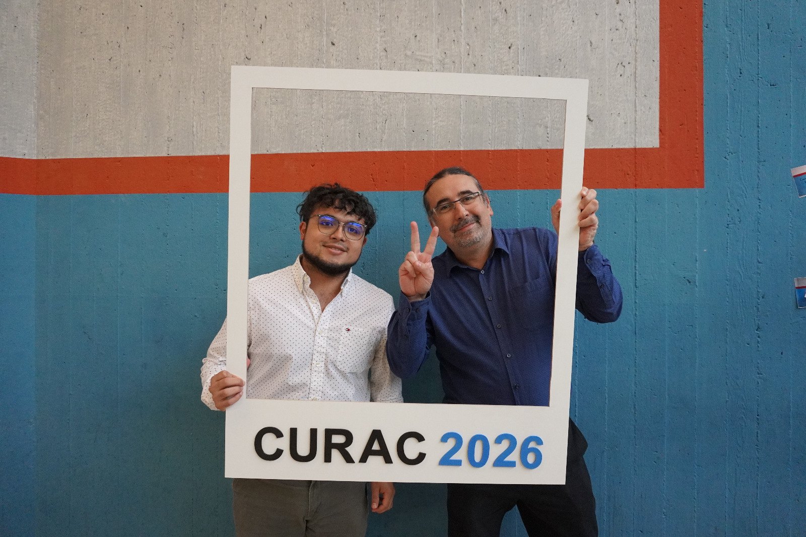 Two VAR Group members with a photo frame reading CURAC 2026